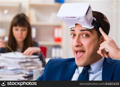Employee with virtual reality glasses in office