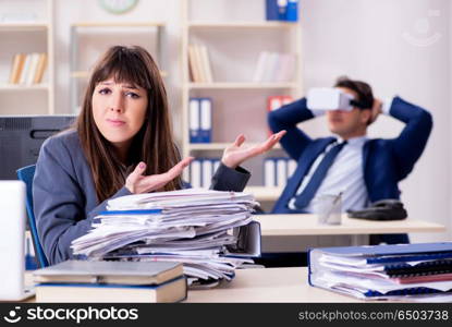 Employee with virtual reality glasses in office