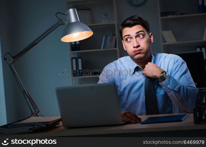 Employee working late at night at important report