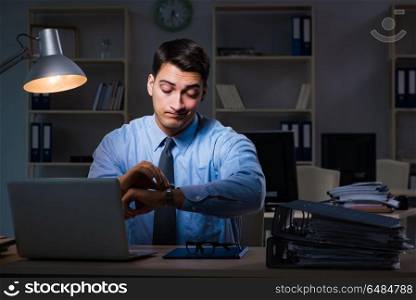 Employee working late at night at important report