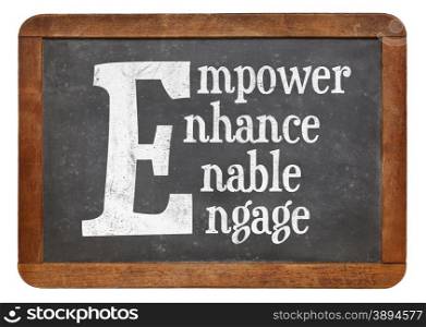 Empower, enhance, enable, engage word abstract - white chalk text on a vintage slate blackboard