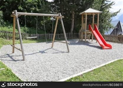 Empty activities at a kids playground in the summer