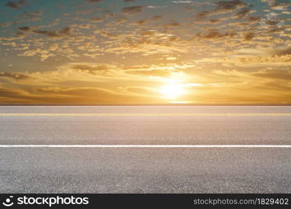 Empty asphalt road and sky nature landscape at sunrise background.