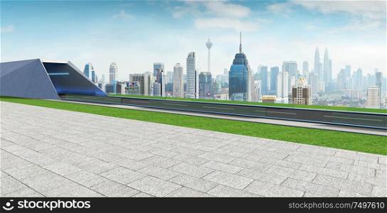 Empty asphalt road with tunnel ,greenfield and modern city skyline background . Mixed media .