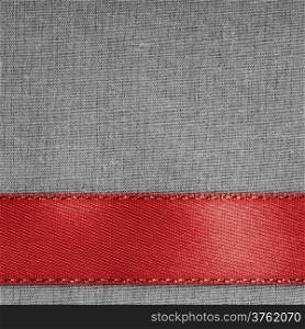 Empty banner on vintage background. Red ribbon on gray fabric cloth texture with copy space. Square format