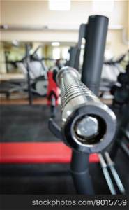 Empty barbell bar waiting to workout, shallow DOF