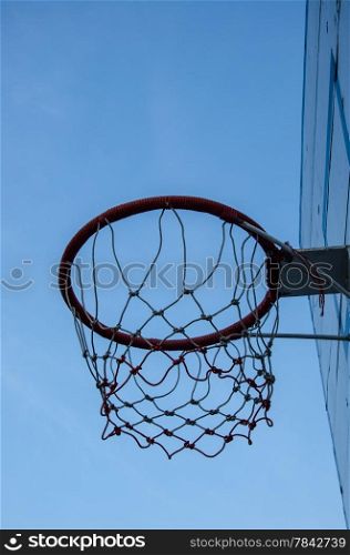 empty basketball hoop for play in playground