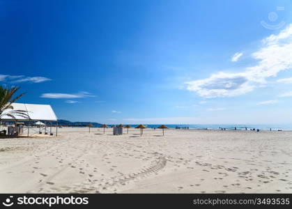 empty beach at sunny day with footprints, Spain