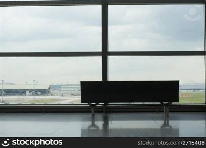 empty bench of the observation deck of airport.