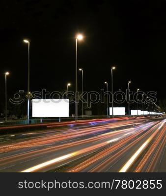 Empty billboards in the highway at night