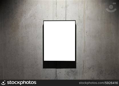 Empty black frame on concrete wall isolated on white