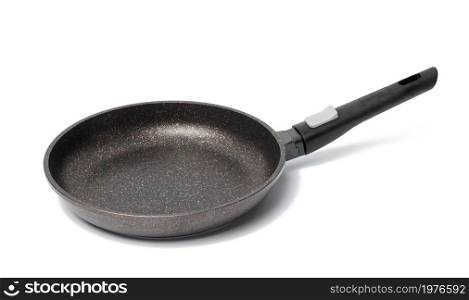 empty black round metal plate with non-stick coating isolated on white background, top view