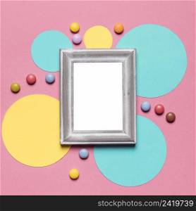 empty blank frame with silver border circular frame with colorful gems pink background