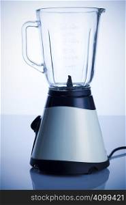 Empty blender on the kitchen table over white background
