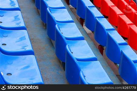 empty blue and red stadium seats