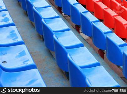 empty blue and red stadium seats