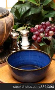 Empty blue bowl in kitchen or restaurant on cutting board.