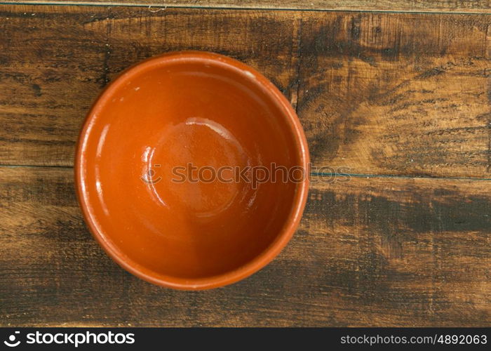 Empty bowl for the kitchen on a wooden background