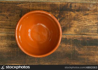 Empty bowl for the kitchen on a wooden background