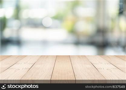Empty brown wood table top on blur background at shopping mall, copy space for montage you product