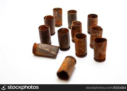 Empty bullet shells on a white background. A pile bullet shells on a white background