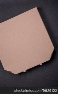 Empty cardboard rectangular brown box for delivery of delicious pizza. Takeaway food packaging