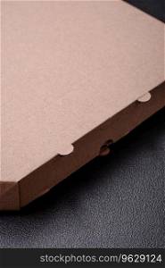 Empty cardboard rectangular brown box for delivery of delicious pizza. Takeaway food packaging