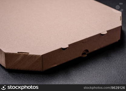 Empty cardboard rectangular brown box for delivery of delicious pizza. Takeaway food packaging