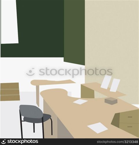 Empty chair and a desk in an office