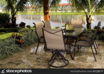 Empty chair and tables in a lawn