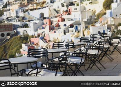 Empty chairs and tables in a restaurant, Greece