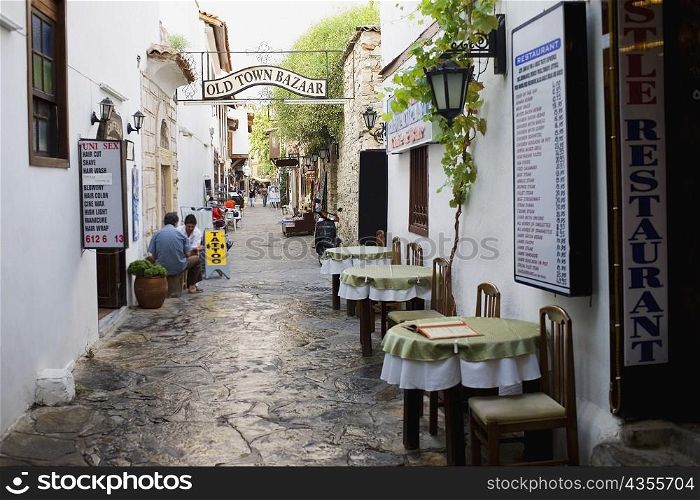 Empty chairs and tables in front of a restaurant in a street, Ephesus, Turkey