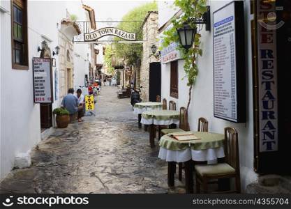 Empty chairs and tables in front of a restaurant in a street, Ephesus, Turkey