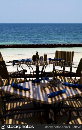 Empty chairs and tables on the beach, Cancun, Mexico