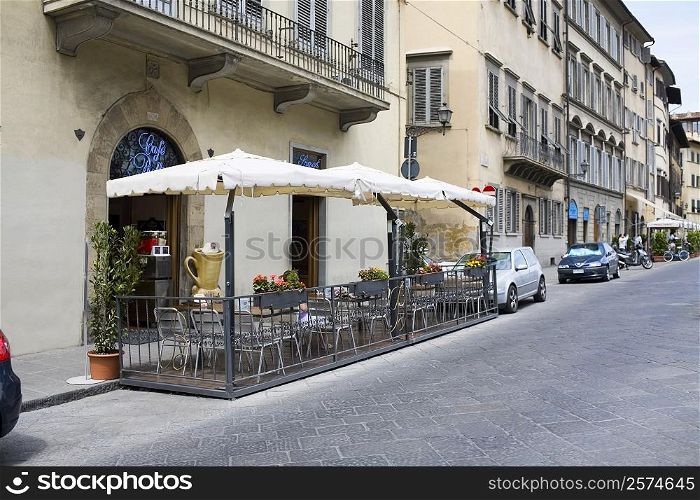 Empty chairs at a sidewalk cafe, Florence, Italy