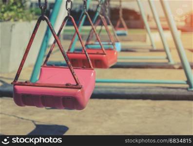 Empty children swing set in outdoor playground