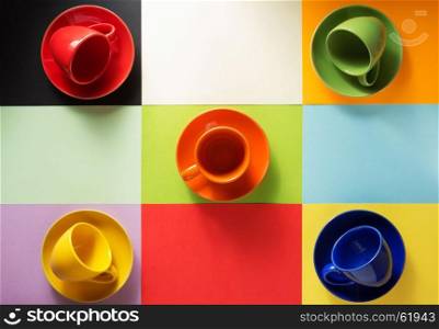 empty coffee cup and plate at abstract colorful background