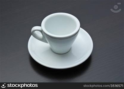 empty coffee cup on a gray table