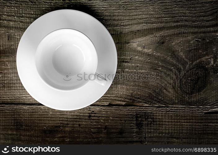 Empty coffee cup on wooden table top view. Empty coffee cup on wooden table