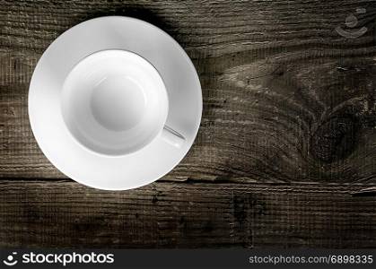 Empty coffee cup on wooden table top view. Empty coffee cup on wooden table