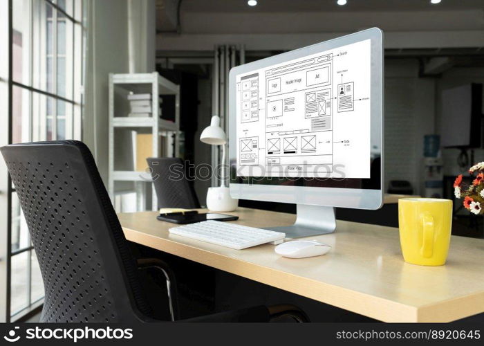 Empty computer monitor screen for design mock up template in modern small office∫erior or home office. Stylish workplace for creative occupation.