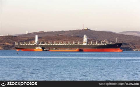 Empty container freighter ship waiting on Vladivostok, Russia. Empty container freighter ship waiting