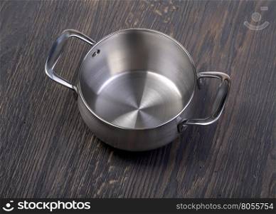 empty cooking pot on rustic wooden background, , copy space