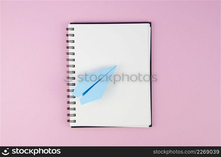 empty copy space notepad with paper plane