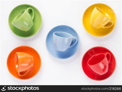 empty cup and saucer on white  background, top view
