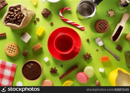 empty cup of coffee at green surface background