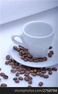 empty cup of coffee with coffee beans
