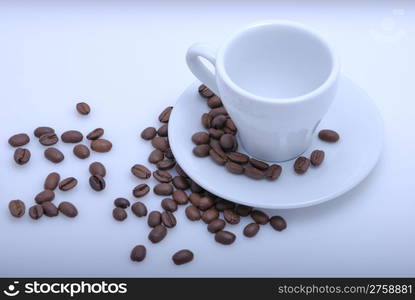 empty cup of coffee with coffee beans