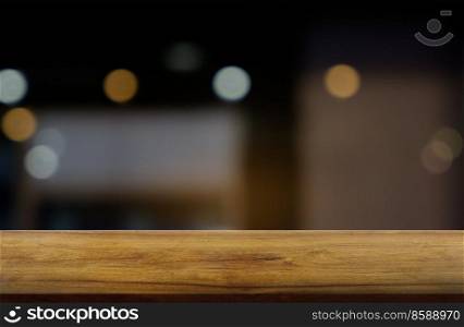 Empty dark wooden table in front of abstract blurred background of restaurant, cafe and coffee shop interior. can be used for display or montage your products - Image