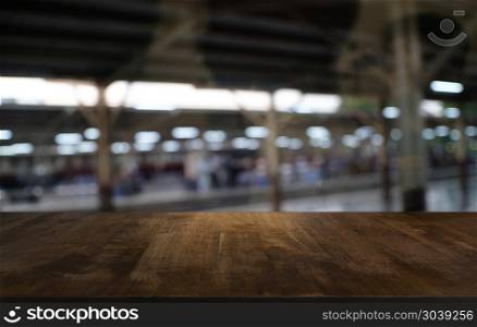 Empty dark wooden table in front of abstract blurred bokeh backg. Empty dark wooden table in front of abstract blurred bokeh background of restaurant . can be used for display or montage your products.Mock up for space